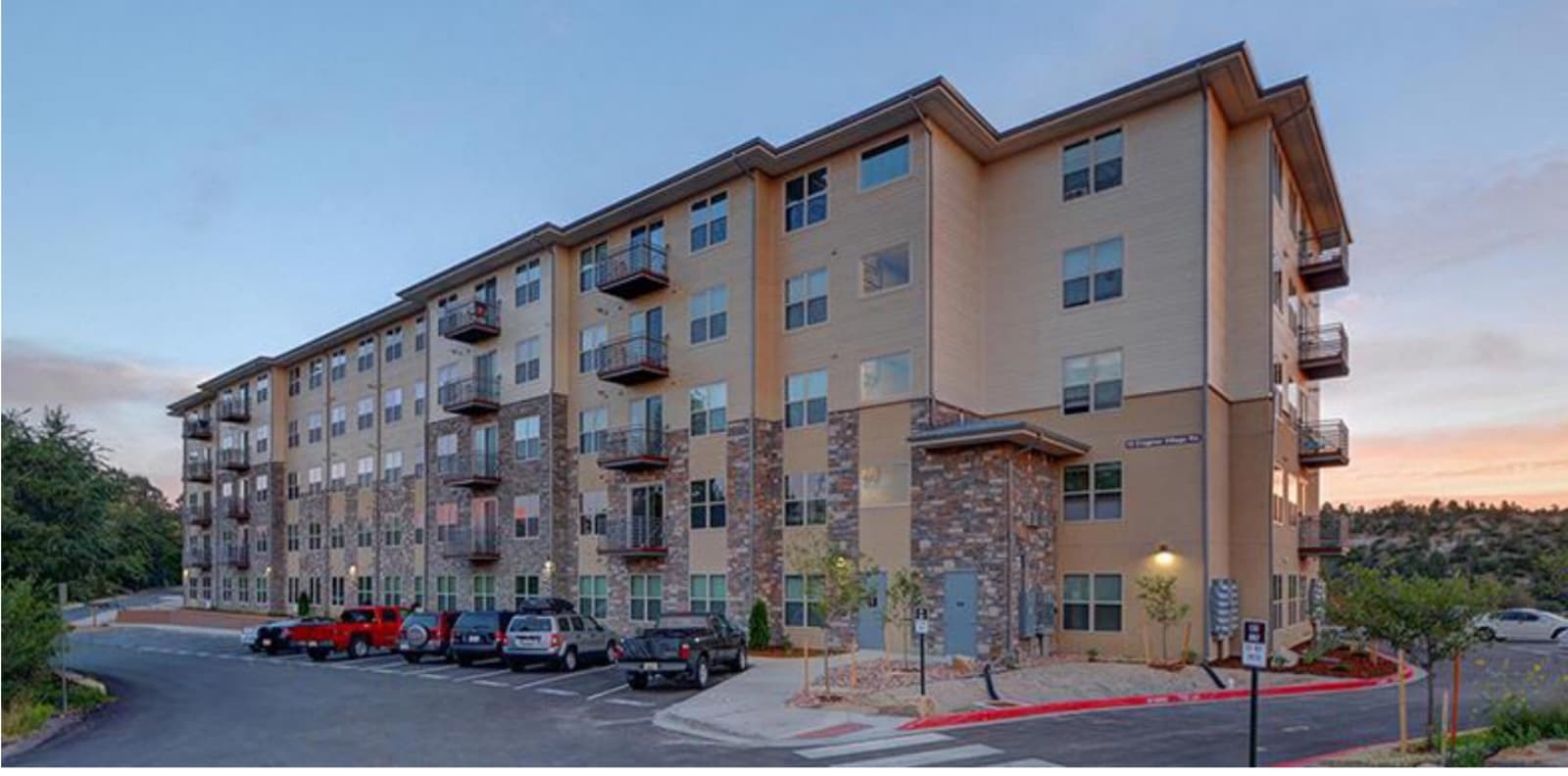 Mid-rise apartment building at dusk